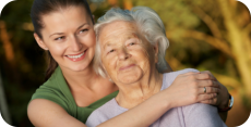 an aged woman with her caretaker